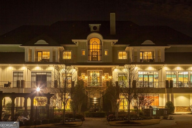 view of back of house at twilight