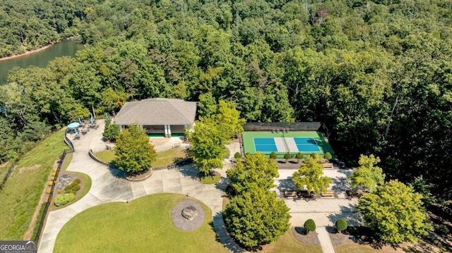 aerial view with a water view and a wooded view