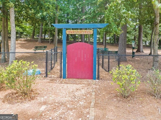 exterior space with a gate and fence