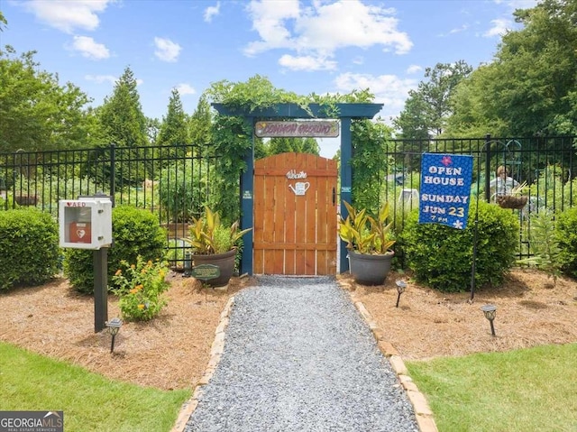 view of gate with fence