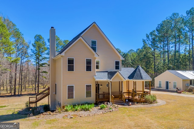 599 Double Branch Rd, Danielsville, GA 30633 - rear view of property featuring a chimney, stairway, a yard, and covered porch