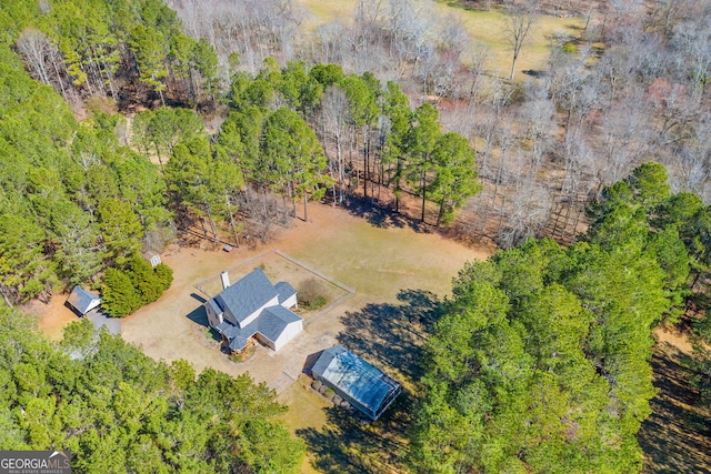 drone / aerial view with a view of trees