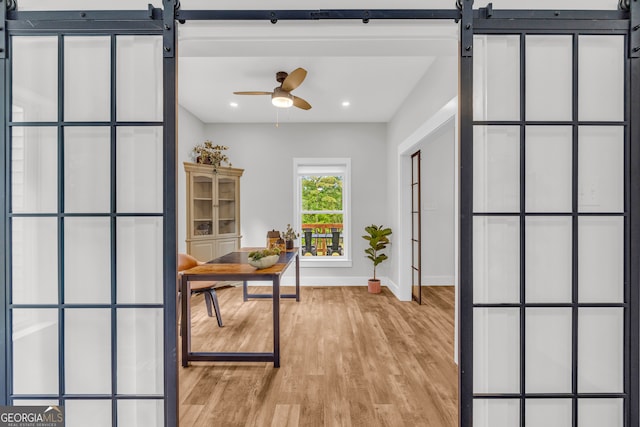 599 Double Branch Rd, Danielsville, GA 30633 - office space featuring a barn door, light wood-style flooring, baseboards, recessed lighting, and ceiling fan