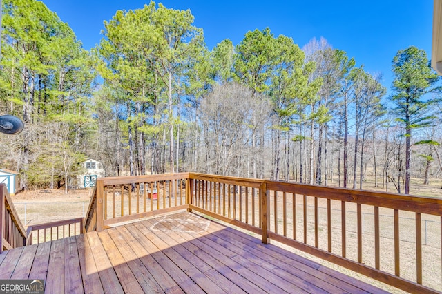 599 Double Branch Rd, Danielsville, GA 30633 - wooden deck with a storage unit and an outdoor structure