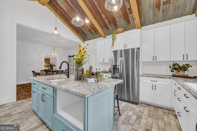 599 Double Branch Rd, Danielsville, GA 30633 - kitchen featuring a sink, stainless steel fridge with ice dispenser, brick floors, wood ceiling, and white cabinets