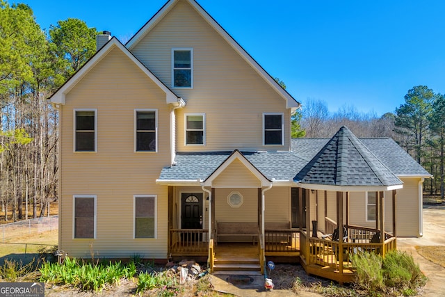 599 Double Branch Rd, Danielsville, GA 30633 - rear view of house with a shingled roof, a chimney, and a porch