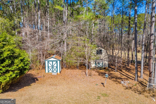 599 Double Branch Rd, Danielsville, GA 30633 - view of yard featuring a shed and an outdoor structure