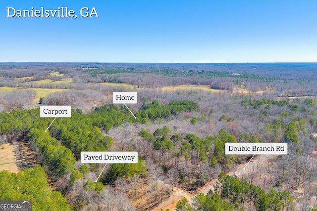 aerial view featuring a view of trees