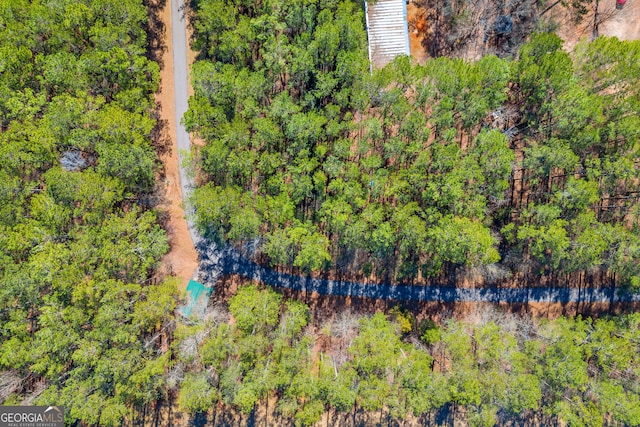 aerial view featuring a view of trees