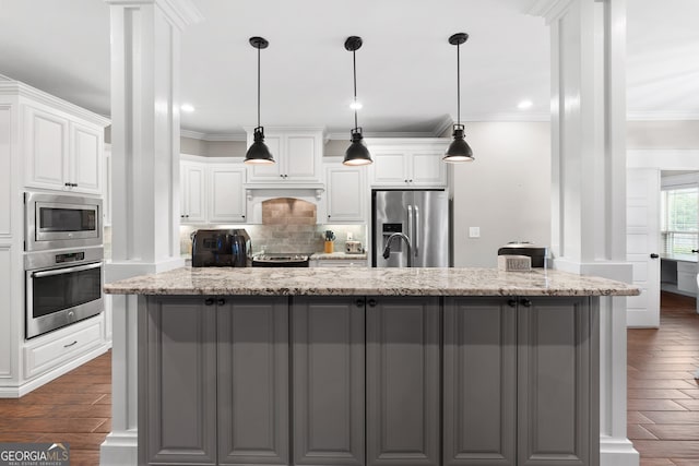 kitchen featuring crown molding, appliances with stainless steel finishes, decorative backsplash, and dark wood-style flooring