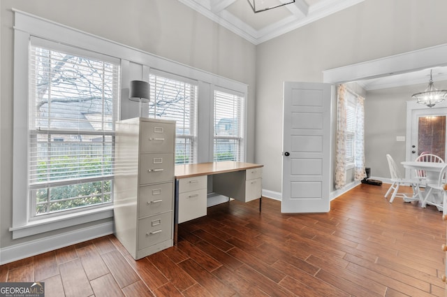 unfurnished office featuring ornamental molding, plenty of natural light, a notable chandelier, and dark wood finished floors