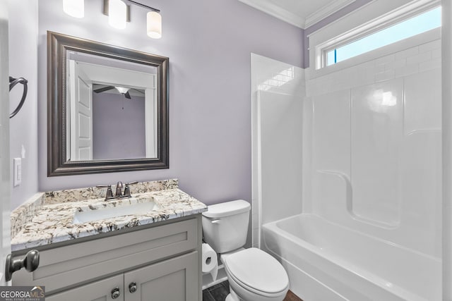 bathroom featuring crown molding, vanity, and toilet