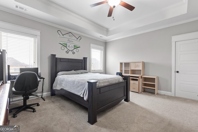 bedroom with light carpet, a raised ceiling, visible vents, and crown molding