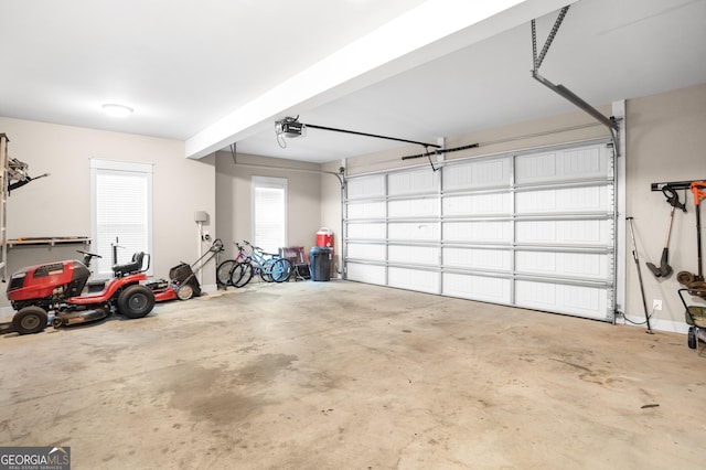 garage featuring baseboards and a garage door opener