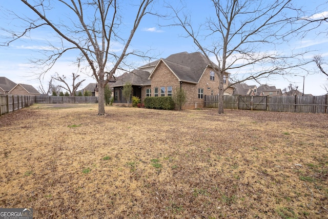 exterior space with a fenced backyard