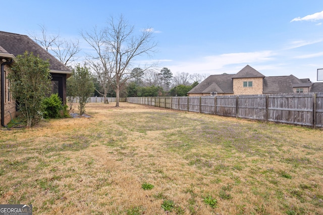 view of yard with a fenced backyard