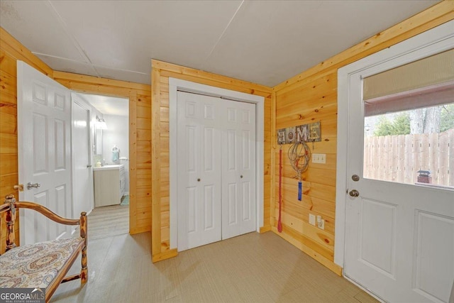 doorway with wooden walls