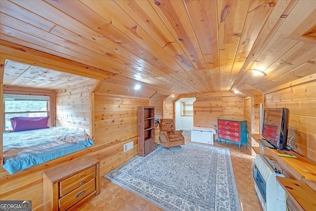 bedroom with lofted ceiling, wood ceiling, visible vents, and wooden walls