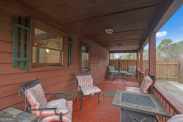 view of patio featuring fence