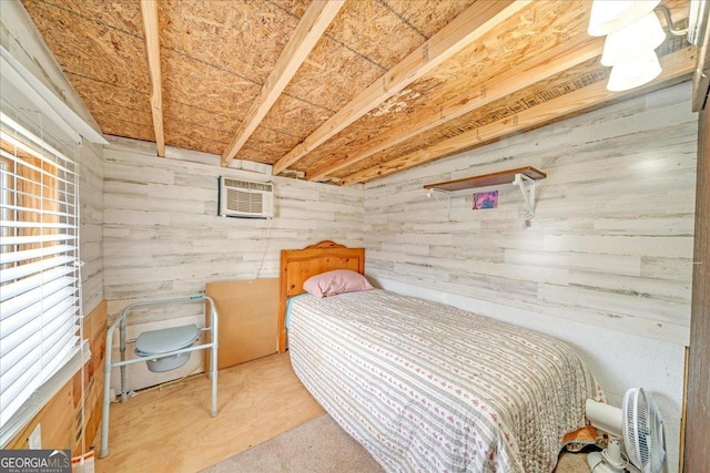 bedroom with wood walls and a wall mounted air conditioner