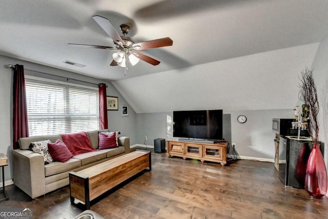 living room with visible vents, ceiling fan, vaulted ceiling, wood finished floors, and baseboards