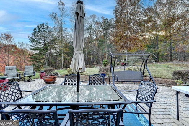 view of patio / terrace with outdoor dining space and an outdoor fire pit