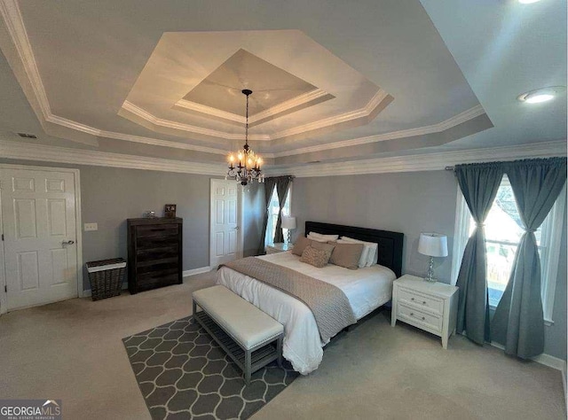 bedroom with light carpet, a tray ceiling, crown molding, and an inviting chandelier