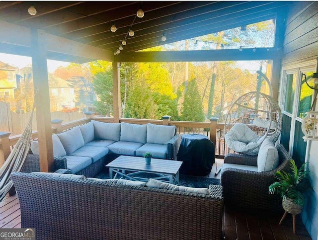 sunroom / solarium featuring lofted ceiling