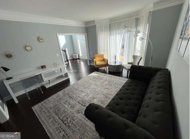 bedroom featuring wood finished floors and crown molding