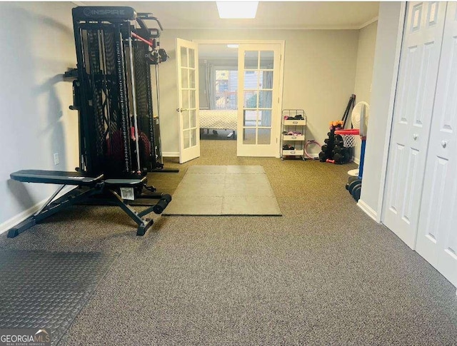 workout area featuring carpet floors, baseboards, and french doors