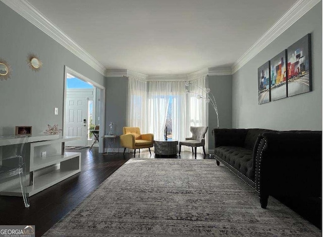 living room featuring hardwood / wood-style flooring and ornamental molding