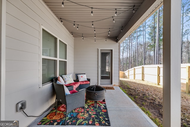 view of patio / terrace featuring fence