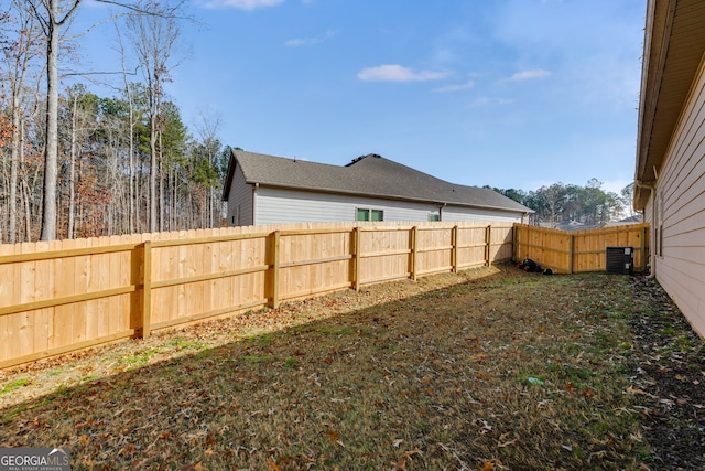 view of yard featuring a fenced backyard and cooling unit