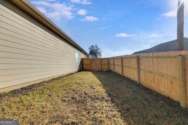 view of yard with a fenced backyard