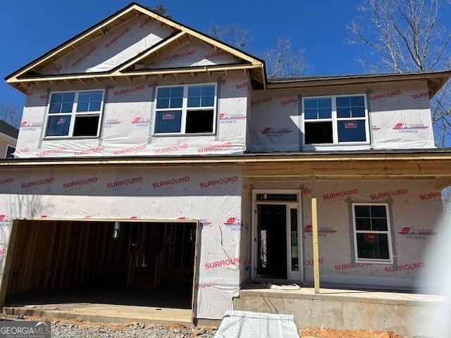 property in mid-construction with a garage