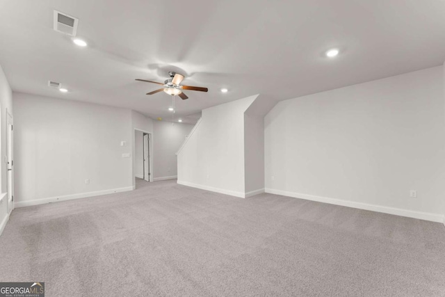 interior space with visible vents, baseboards, light colored carpet, ceiling fan, and recessed lighting