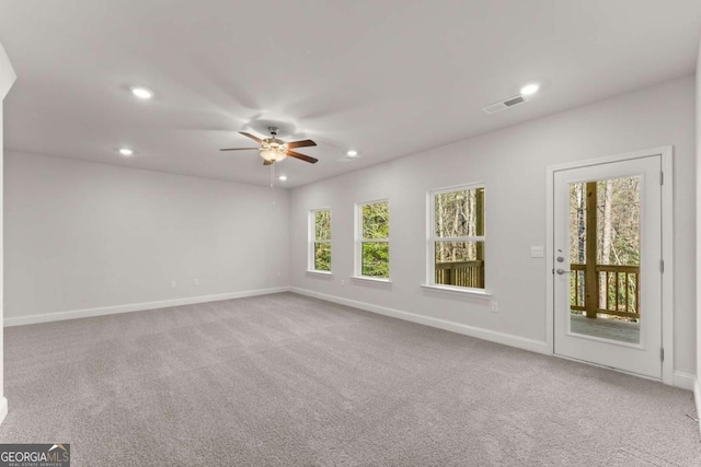 empty room with baseboards, visible vents, a ceiling fan, carpet floors, and recessed lighting