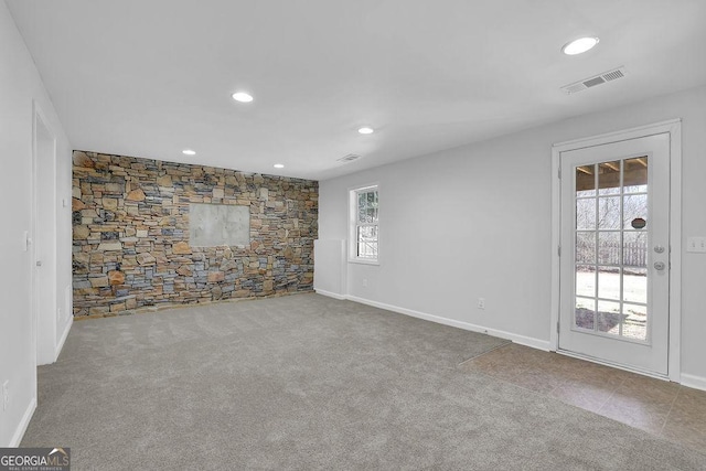 unfurnished room with carpet floors, baseboards, visible vents, and recessed lighting