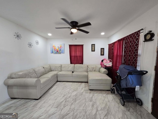 living room featuring ceiling fan, marble finish floor, baseboards, and recessed lighting