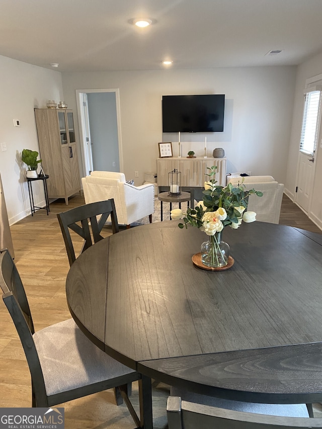 dining room with recessed lighting, visible vents, baseboards, and wood finished floors