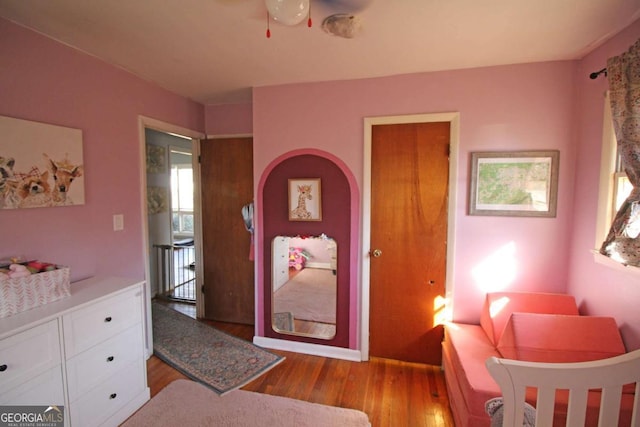 bedroom with wood finished floors