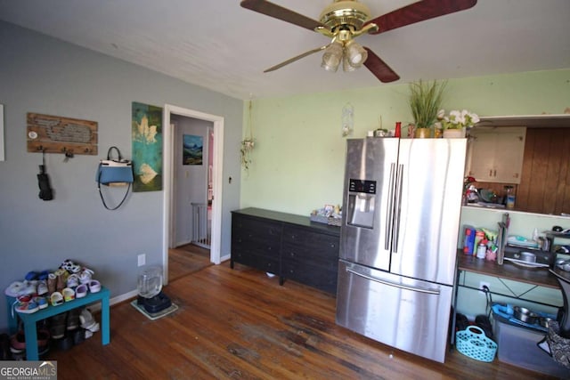 kitchen featuring baseboards, wood finished floors, a ceiling fan, and stainless steel fridge with ice dispenser