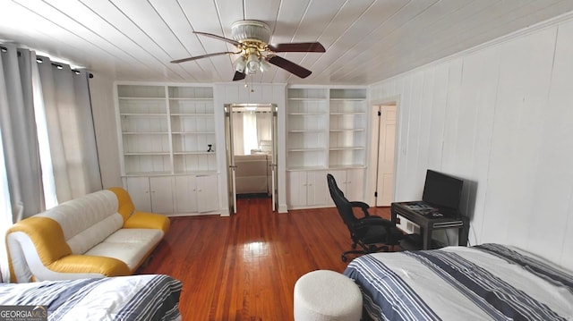 bedroom with a ceiling fan, wood ceiling, and wood finished floors