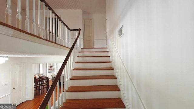 8875 E Broad St, Sparta, GA 31087 - staircase with a high ceiling and wood finished floors