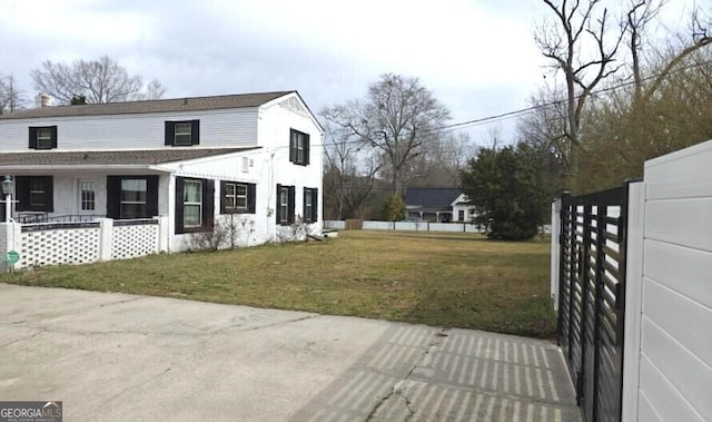 view of property exterior with a yard