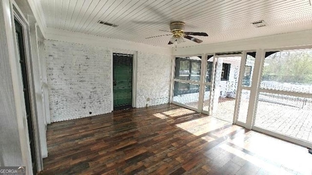 unfurnished sunroom with a ceiling fan and wood ceiling