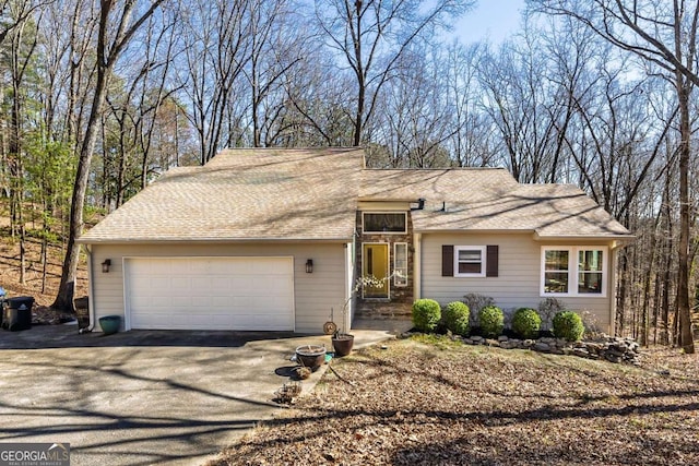 view of front of home with driveway and an attached garage