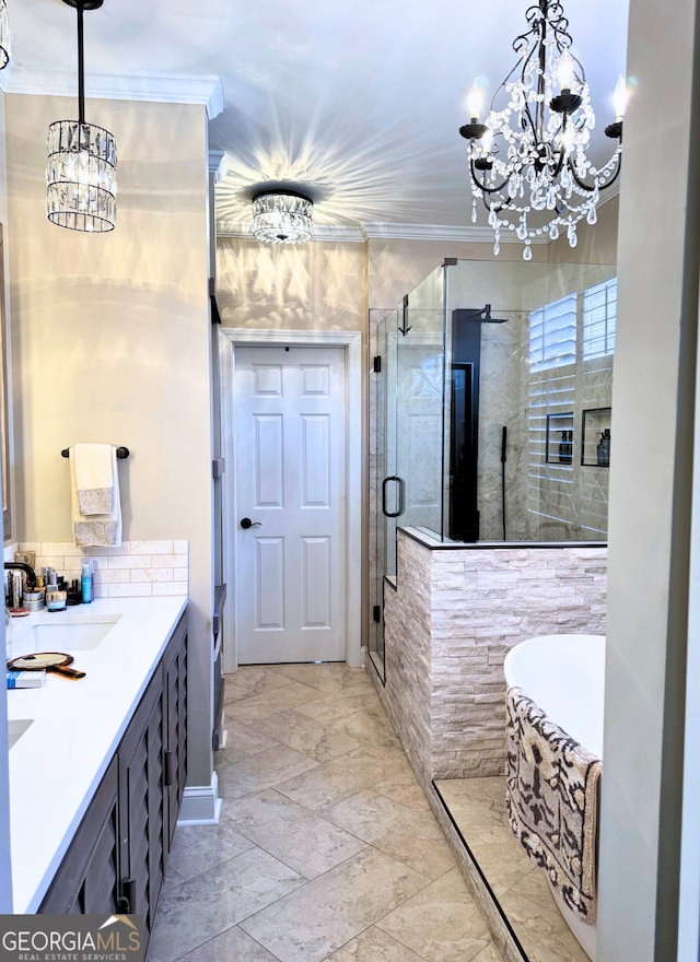 full bathroom featuring a tub, ornamental molding, an inviting chandelier, marble finish floor, and a shower stall