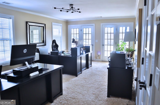 office featuring ornamental molding, a healthy amount of sunlight, light colored carpet, and visible vents