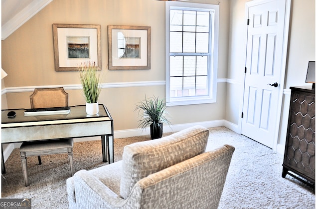 living area featuring baseboards